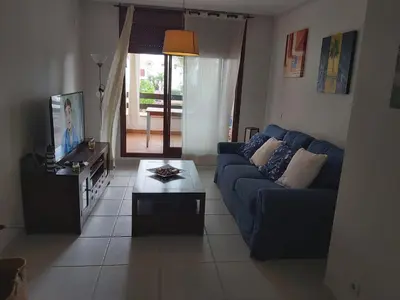 Una televisión o centro de entretenimiento en Apartamento Vera Playa (ALTOS NUEVA VERA)