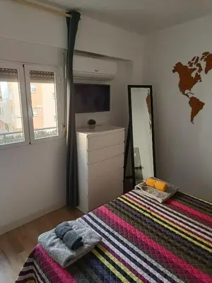 Cama o camas de una habitación en Piso agradable cerca de la playa