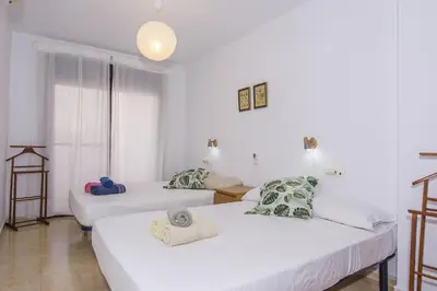 Cama o camas de una habitación en Un Paso del Mar Apartment
