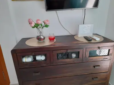 Una televisión o centro de entretenimiento en Ático con Espectaculares Vistas al Mar