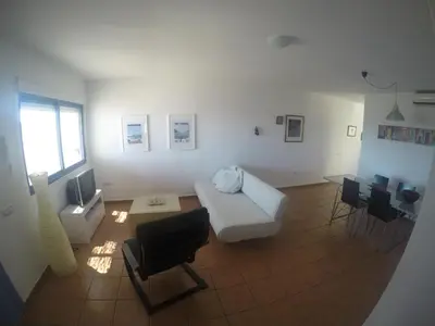 Una televisión o centro de entretenimiento en Apartamento en las Negras, a 1 minuto de la playa
