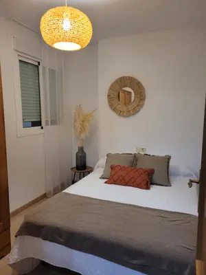 Cama o camas de una habitación en Piso céntrico en 2° línea de playa