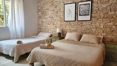 Cama o camas de una habitación en Bakit House - Casa rural con piscina