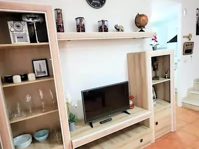 Una televisión o centro de entretenimiento en Duplex in Urb Naturista near Beach & Pool