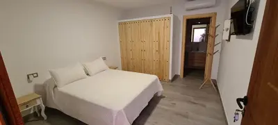 Cama o camas de una habitación en Alojamientos Tía María
