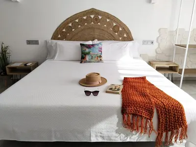 Cama o camas de una habitación en Hostal Aires del Mar