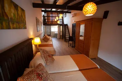 Cama o camas de una habitación en El Palacete de Cuevas