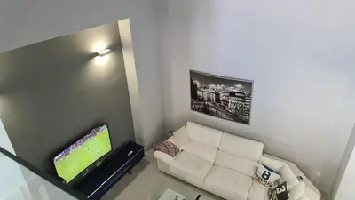 Una televisión o centro de entretenimiento en TRIPLEX DE LUJO EN MOJACAR