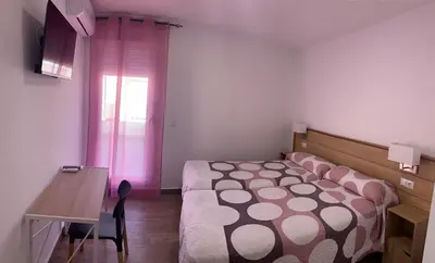 Cama o camas de una habitación en ALOJAMIENTOS AGAVE