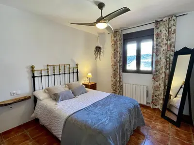 Cama o camas de una habitación en La casita del pueblo