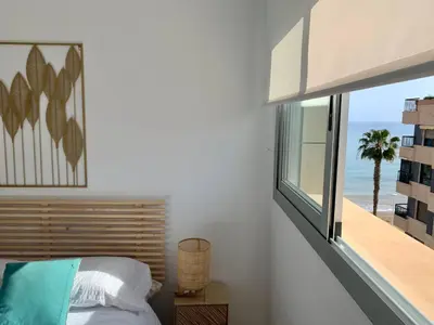 Cama o camas de una habitación en Precioso apartamento primera línea de playa