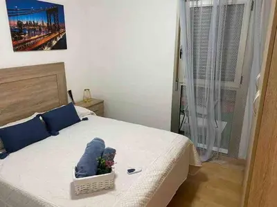 Cama o camas de una habitación en Precioso apartamento en zona de playa
