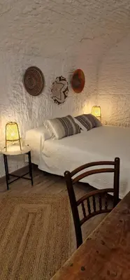 Cama o camas de una habitación en Cueva de la Higuera