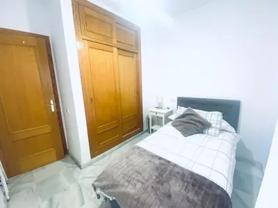 Cama o camas de una habitación en Apartamento de dos dormitorios en Almería.