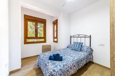 Cama o camas de una habitación en Casa Gómez, parking gratuito en Pleno Centro