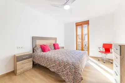Cama o camas de una habitación en Casa Gómez, parking gratuito en Pleno Centro