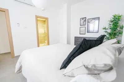 Cama o camas de una habitación en Moott Homes Suites Casa de los Leones APTO 1