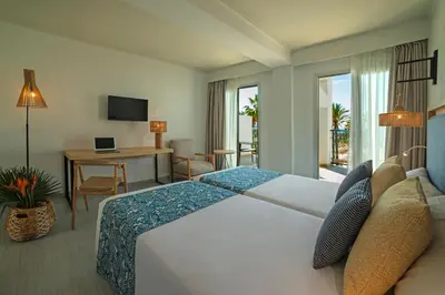 Cama o camas de una habitación en Hotel Cabogata Jardín