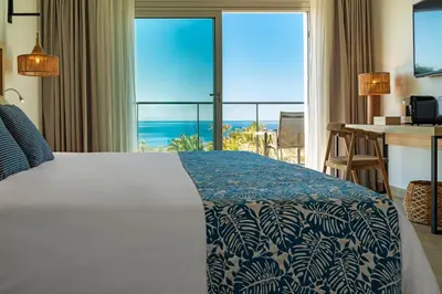 Cama o camas de una habitación en Hotel Cabogata Jardín