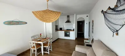 Zona de estar de NEPTUNITO: Primera línea con Piscina