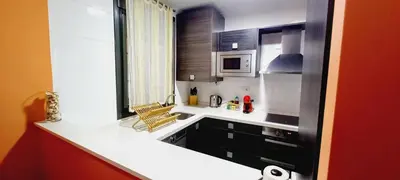 Una cocina o zona de cocina en Apartamento El Zapillo