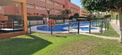 Piscina en o cerca de Homes of Spain, Apartamentos Paraiso Vera Playa, Ed Tahiti, Atico F de 2 dormitorios con piscina privada en solárium y barbacoa, pie de playa