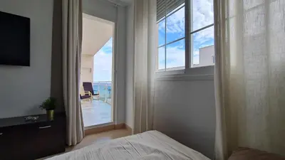 Cama o camas de una habitación en Ático Parque Salinas BEACHFRONT