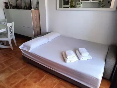 Cama o camas de una habitación en Precioso apartamento con piscina y garage