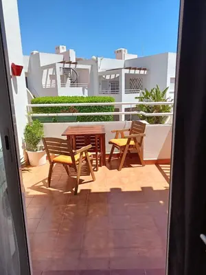 Un balcón o terraza de Precioso apartamento con piscina y garage
