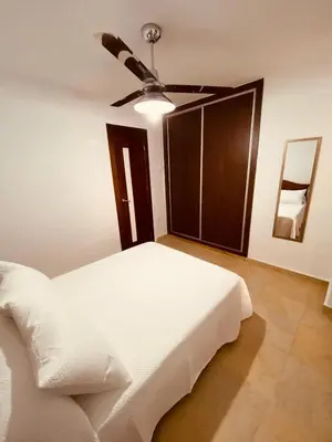 Cama o camas de una habitación en APARTAMENTO BUEN DÍA