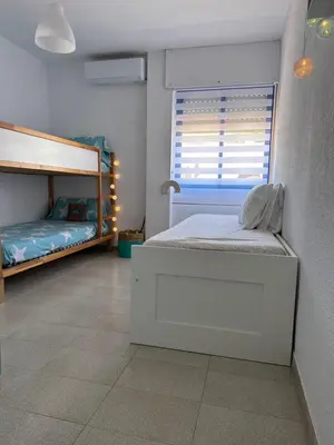 Cama o camas de una habitación en Tu casita en San José con acceso directo a playa