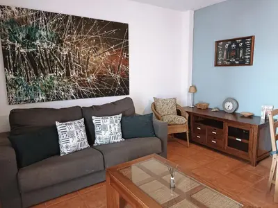 Zona de estar de Casa baja naturista con patio en primera línea de playa con piscina comunitaria!