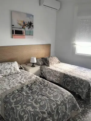 Cama o camas de una habitación en Alojamiento Dunas centro