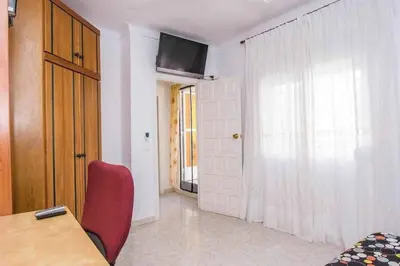 Una televisión o centro de entretenimiento en Dúplex El paseo Marítimo