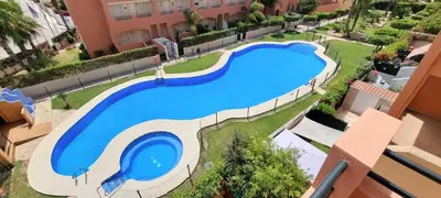 Piscina en o cerca de Homes of Spain, Apartamentos Paraiso , Ed Palmerston, Atico K a pie de playa, piscina privada en solarium, WiFi