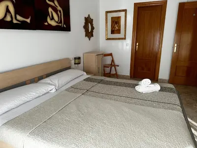 Cama o camas de una habitación en Habitaciones a 10 minutos de la playa de Aguadulce