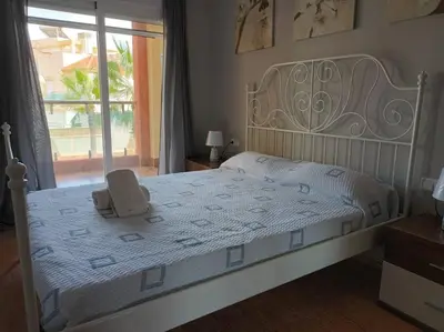 Cama o camas de una habitación en Altas Entinas Almerimar Two bedroom apartment with parking, Wi-Fi and Pool