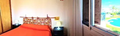 Cama o camas de una habitación en Ático piscina Veramar 5 Vera Playa primera línea de playa